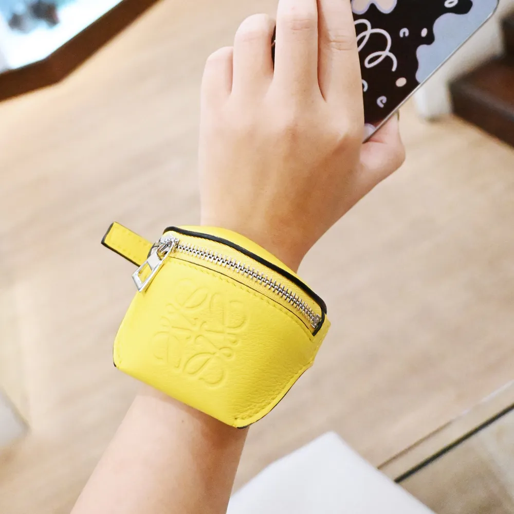 LOEWE 烙印LOGO撞色小牛皮釦式零錢短夾.亮橘 歷史價格詳細信息