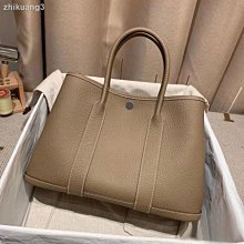 【熱賣精選】 包包女2021新款花園包單肩斜挎水桶包大容量托特包寬肩帶手提大包 歷史價格詳細信息