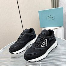 PRADA 品牌標誌黑尼龍布皮飾邊斜肩包 歷史價格詳細信息