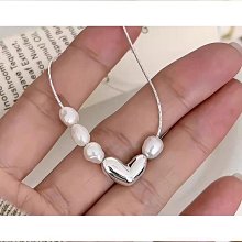 不規則蛇紋珠珠包包 歷史價格詳細信息